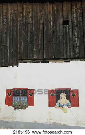 Stock Photograph - Slovenia, Julian Alps, Gorenjska region, Mural of buxom barmaid; Kranjska Gora. Fotosearch