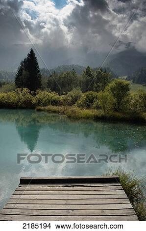 Slovenia, Julian Alps, Jetty at lake; Gorenjska region View Large Photo Image Picture - Slovenia, Julian Alps, Jetty at lake; Gorenjska region. Fotosearch