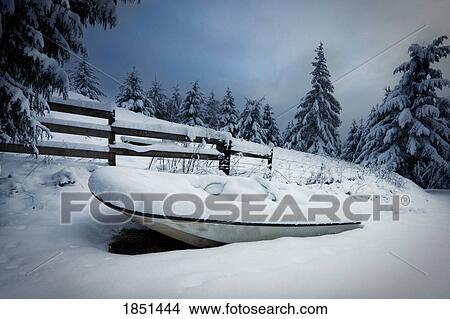 Small Boat By A Fence In Winter View Large Photo Image Picture - Small Boat By A Fence In Winter. Fotosearch