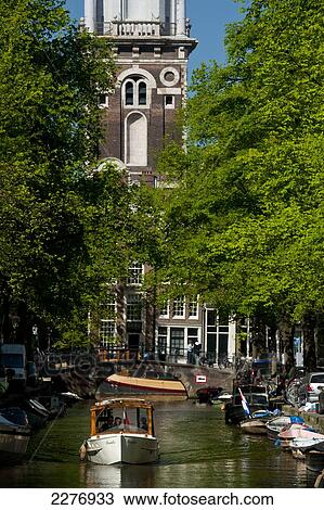 Small boat going along canal with the Zuiderkerk church at the end; Amsterdam, Holland View Large Photo Image Stock Image - Small boat going along canal with the Zuiderkerk church at the end; Amsterdam, Holland. Fotosearch