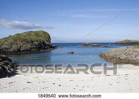 Stock Image - Small Boat Parked Near A Beach. Fotosearch