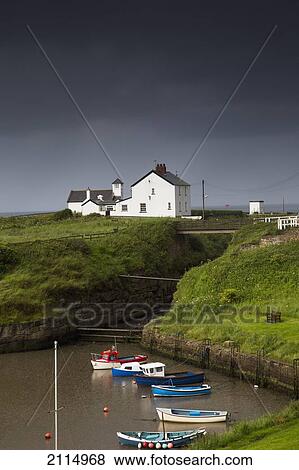 Small Boats In A Harbour Under Storm Clouds; England View Large Photo Image Stock Photo - Small Boats In A Harbour Under Storm Clouds; England. Fotosearch