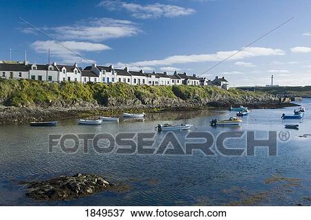 Stock Photo - Small Boats In The Water Near Houses; Island Of Islay, Scotland. Fotosearch