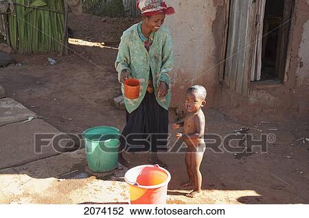 Small Boy Crying As He Is Being Washed In Ambalavao, Fianarantsoa Province, Madagascar View Large Photo Image Stock Image - Small Boy Crying As He Is Being Washed In Ambalavao, Fianarantsoa Province, Madagascar. Fotosearch