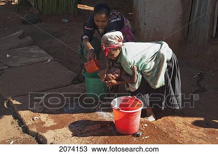 Small Boy Crying As He Is Being Washed In Ambalavao, Fianarantsoa Province, Madagascar View Large Photo Image Stock Image - Small Boy Crying As He Is Being Washed In Ambalavao, Fianarantsoa Province, Madagascar. Fotosearch