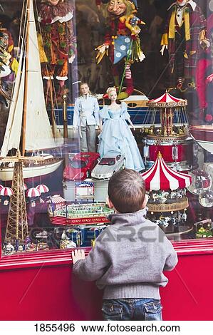 Small Boy Looking In Toy Shop Window View Large Photo Image Stock Photograph - Small Boy Looking In Toy Shop Window. Fotosearch