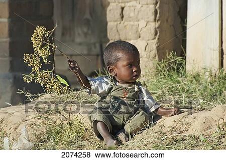Small Boy Playing With A Tree Branch In Ranohira, Fianarantsoa Province, Madagascar View Large Photo Image Stock Photo - Small Boy Playing With A Tree Branch In Ranohira, Fianarantsoa Province, Madagascar. Fotosearch