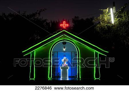 Stock Photograph - Small chapel at dusk; Candolim, Goa, India. Fotosearch