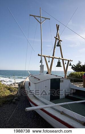 Stock Photo - Small Fishing Boat And Bell Tower Outside The House & Museum Of Poet Pablo Neruda, 1971 Nobel Literature Prize Winner, Isla Negra, Valparaiso Region, Chile. Fotosearch