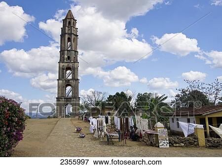 Small Houses And Vendor's Stalls Lining The Pathway To The Lookout Tower At Hacienda De Manaca Iznaga, In Valley De Los Ingenios, Once Known For Sugar Production; Trinidad, Sancti Spiritus, Cuba View Large Photo Image Stock Photo - Small Houses And Vendor's Stalls Lining The Pathway To The Lookout Tower At Hacienda De Manaca Iznaga, In Valley De Los Ingenios, Once Known For Sugar Production; Trinidad, Sancti Spiritus, Cuba. Fotosearch