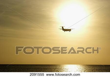 Small Plane Coming In To Land At Montego Bay Airport At Dusk, Jamaica. View Large Photo Image Stock Photography - Small Plane Coming In To Land At Montego Bay Airport At Dusk, Jamaica.. Fotosearch