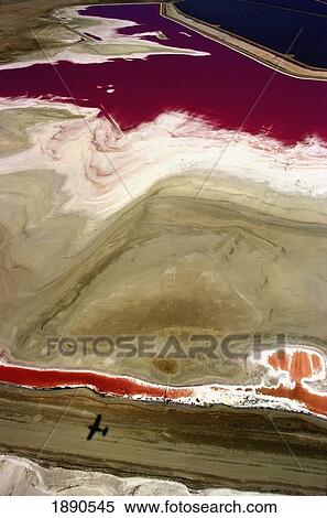 Small Plane Flies Over Colourful Salt Flats View Large Photo Image Stock Photography - Small Plane Flies Over Colourful Salt Flats. Fotosearch