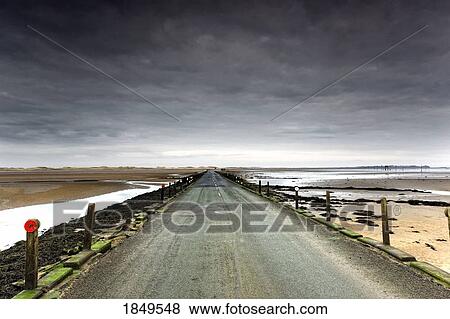 Small Road Near A Beach; Northumberland, England View Large Photo Image Stock Photo - Small Road Near A Beach; Northumberland, England. Fotosearch