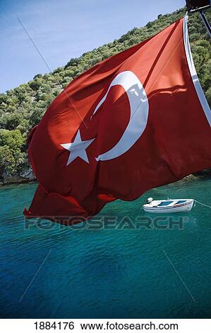 Stock Photograph - Small Row Boat Moored In Bay Next To Island. Fotosearch