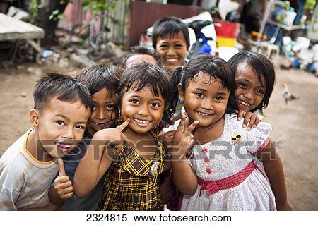 Smiling Children Who Live And Play In Illegal, Unsanitary Garbage Dump, Bali, Indonesia View Large Photo Image Stock Photography - Smiling Children Who Live And Play In Illegal, Unsanitary Garbage Dump, Bali, Indonesia. Fotosearch