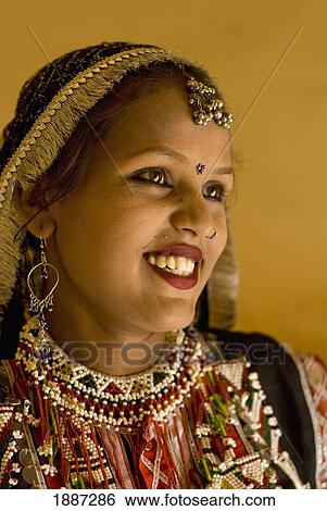 Stock Photograph - Smiling Woman In Traditional Rajasthani Sari And Jewellery. Fotosearch