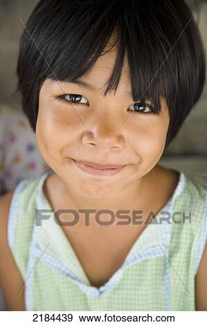 Stock Photo - Smiling Young Local Girl. Bangkok, Thailand. Fotosearch