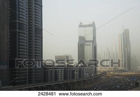 Smog in the air surrounding skyscrapers; Dubai, United Arab Emirates View Large Photo Image Stock Image - Smog in the air surrounding skyscrapers; Dubai, United Arab Emirates. Fotosearch