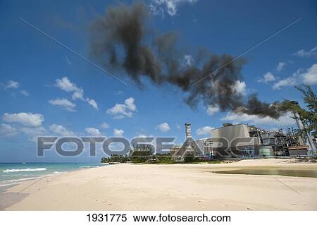 Stock Photography - Smoke Coming Out Of The Power Station Beside Brighton Beach, Barbados; Barbados. Fotosearch
