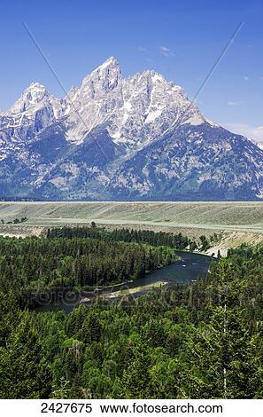Stock Photography - Snake River overlook, Teton Mountains in the distance; Wyoming, United States of America. Fotosearch