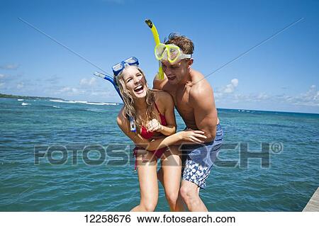 Snorkelers playing at the water's edge; Upulu Island, Samoa View Large Photo Image Stock Photograph - Snorkelers playing at the water's edge; Upulu Island, Samoa. Fotosearch