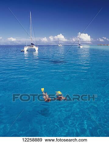 Stock Photo - Snorkelling; Tahiti. Fotosearch