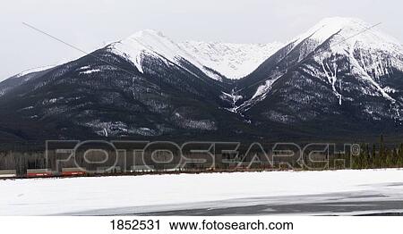 Snow-Capped Mountains, Banff, Alberta, Canada View Large Photo Image Stock Image - Snow-Capped Mountains, Banff, Alberta, Canada. Fotosearch