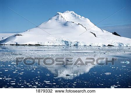 Stock Image - Snow-Covered Mountains And Sea. Fotosearch