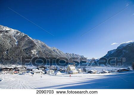 Snow Covered Village With Mountains And Picturesque Church In A Valley Below Ski Slopes At Waidring, Austrian Alps, Austria View Large Photo Image Stock Image - Snow Covered Village With Mountains And Picturesque Church In A Valley Below Ski Slopes At Waidring, Austrian Alps, Austria. Fotosearch