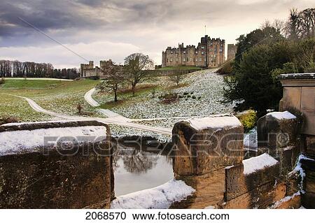 Snow On The Hills And Bridge With Alnwick Castle In The Background; Alnwick Northumberland England View Large Photo Image Stock Image - Snow On The Hills And Bridge With Alnwick Castle In The Background; Alnwick Northumberland England. Fotosearch
