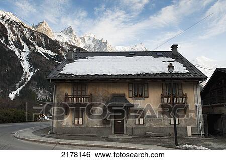 Snow On The Roof Of A Building With The French Alps In The Background; Chamonix-Mont-Blanc Rhone-Alpes France View Large Photo Image Stock Photograph - Snow On The Roof Of A Building With The French Alps In The Background; Chamonix-Mont-Blanc Rhone-Alpes France. Fotosearch