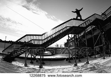 Snowboarder balancing on the handrail of steps; Minnesota, United States of America View Large Photo Image Stock Photography - Snowboarder balancing on the handrail of steps; Minnesota, United States of America. Fotosearch