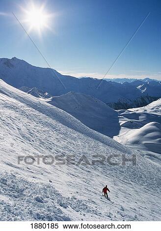 Stock Photography - Snowboarder Going Off Piste. Fotosearch