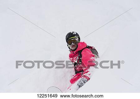 Snowboarder sitting in deep powder snow; St. Moritz, Graubunden, Switzerland View Large Photo Image Stock Photo - Snowboarder sitting in deep powder snow; St. Moritz, Graubunden, Switzerland. Fotosearch