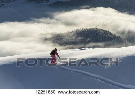 Snowboarding above the clouds; St. Moritz, Graubunden, Switzerland View Large Photo Image Stock Image - Snowboarding above the clouds; St. Moritz, Graubunden, Switzerland. Fotosearch