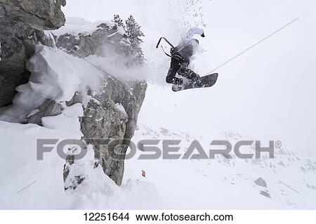 Picture - Snowboarding in powder snow; St. Moritz, Switzerland. Fotosearch