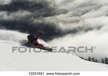 Stock Image - Snowboarding in powder snow; St. Moritz, Graubunden, Switzerland. Fotosearch