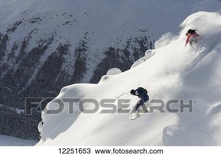 Snowboarding in powder snow; St. Moritz, Graubunden, Switzerland View Large Photo Image Stock Image - Snowboarding in powder snow; St. Moritz, Graubunden, Switzerland. Fotosearch