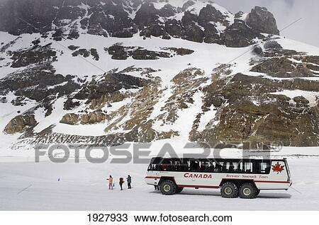Snowcoach, Mountains In Background, Alberta, Canada View Large Photo Image Stock Image - Snowcoach, Mountains In Background, Alberta, Canada. Fotosearch