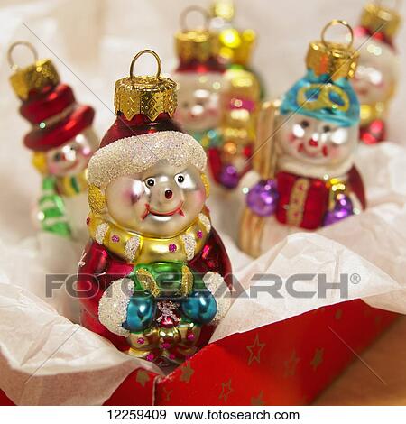 Snowmen Christmas ornaments in a red box with tissue; Victoria, British Columbia, Canada View Large Photo Image Stock Photo - Snowmen Christmas ornaments in a red box with tissue; Victoria, British Columbia, Canada. Fotosearch