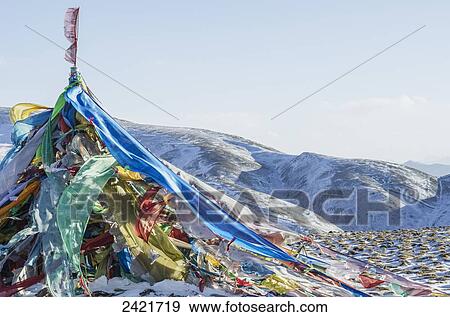 Snowy landscape with prayer flags on a high altitude mountain pass; Tibet View Large Photo Image Stock Photo - Snowy landscape with prayer flags on a high altitude mountain pass; Tibet. Fotosearch