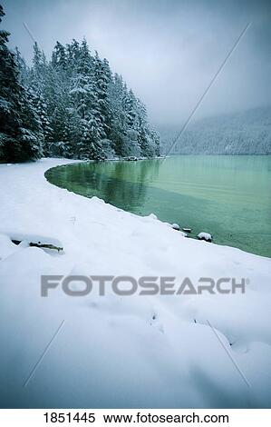Stock Photography - Snowy Shoreline Of A Lake. Fotosearch