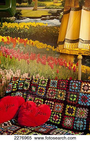 Stock Photography - Sofa and I Love you cushions in Tart of my Aunt cafe; Amsterdam, Holland. Fotosearch