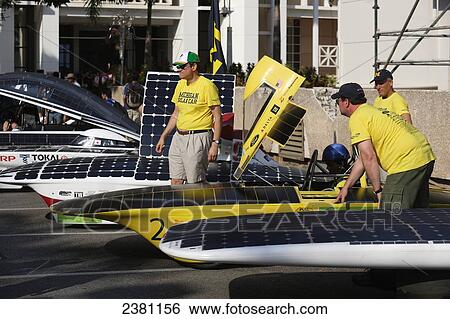 Stock Photograph - Solar cars prepare to depart; Darwin, Australia. Fotosearch