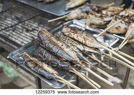 Some sticks with local fish from famous Crab Market of Kep; Kep, Cambodia View Large Photo Image Stock Photography - Some sticks with local fish from famous Crab Market of Kep; Kep, Cambodia. Fotosearch