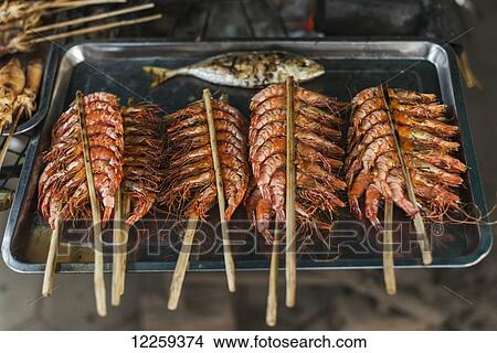 Picture - Some sticks with shrimp from famous Crab Market of Kep; Kep, Cambodia. Fotosearch