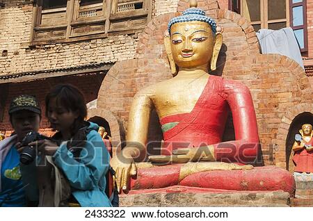 Some tourist under the watchful eye of Buddha in Swayambhu Temple; Kathmandu, Nepal View Large Photo Image Stock Image - Some tourist under the watchful eye of Buddha in Swayambhu Temple; Kathmandu, Nepal. Fotosearch