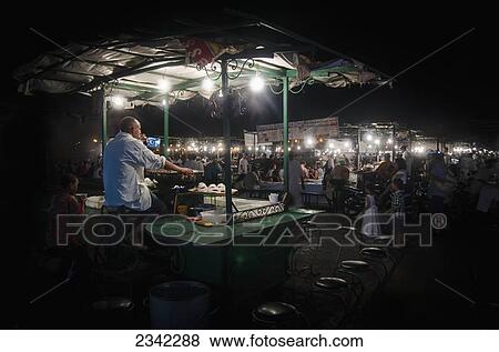 Stock Photo - Souk With Street Food At Night; Morocco. Fotosearch