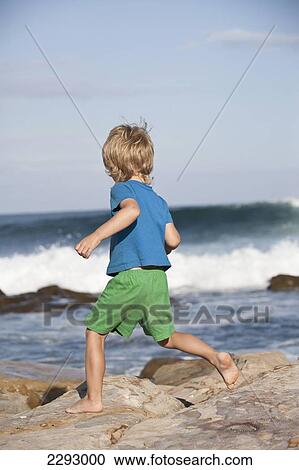 South Africa, Boy (6-7) Running On Rocky Beach; Mossel Bay View Large Photo Image Stock Image - South Africa, Boy (6-7) Running On Rocky Beach; Mossel Bay. Fotosearch