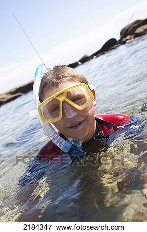 Stock Photo - South Africa, Boy Snorkeling; Mossel Bay. Fotosearch